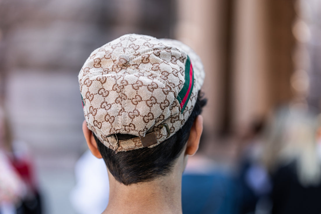 a man with a hat on top of his head