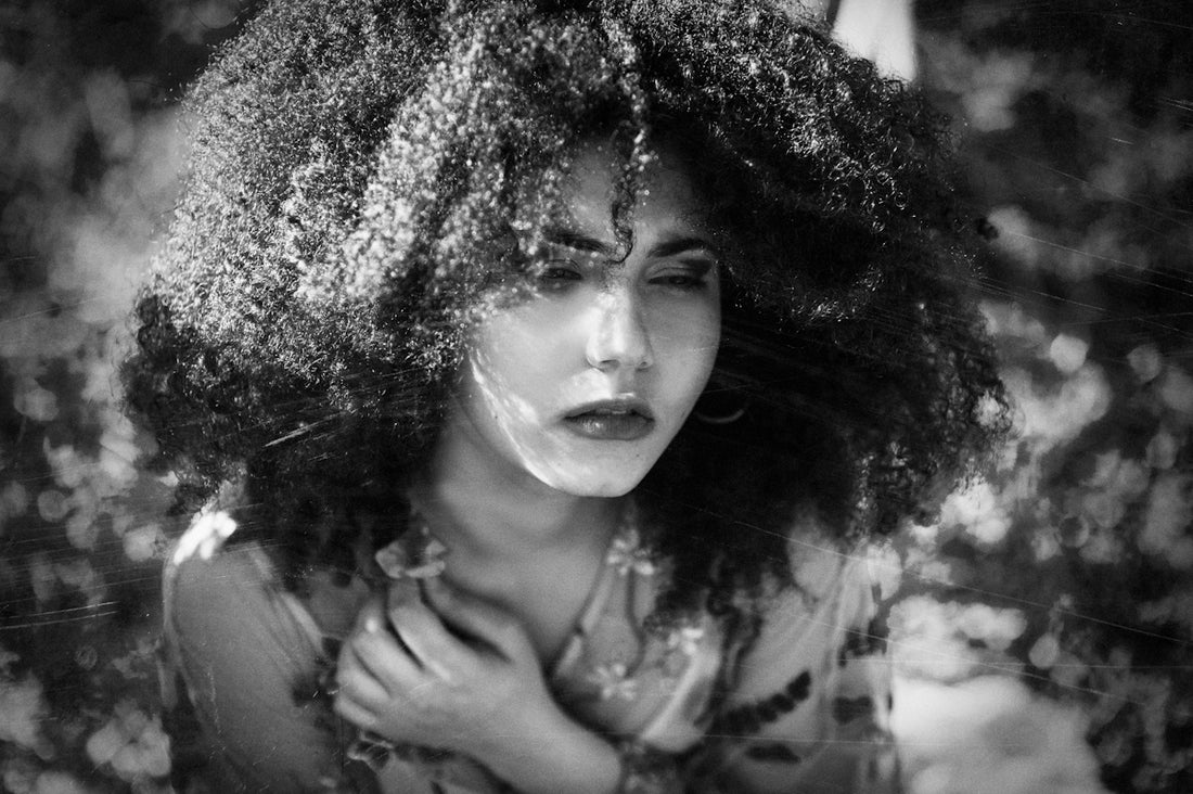 grayscale photography of woman wearing crew-neck 34-sleeved top