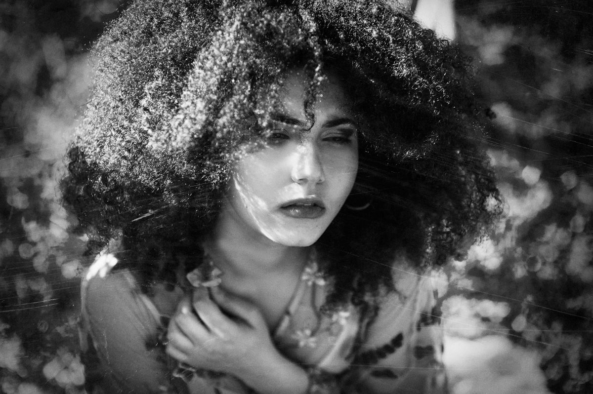 grayscale photography of woman wearing crew-neck 34-sleeved top