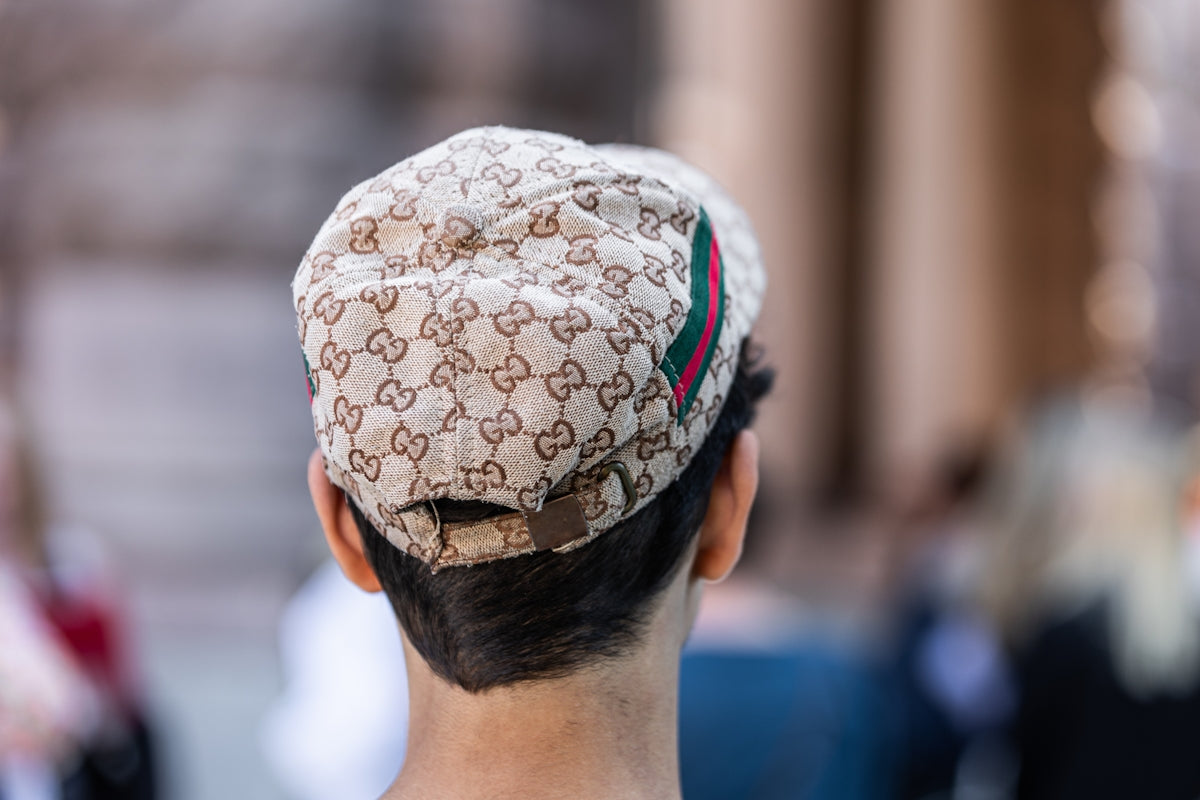 a man with a hat on top of his head