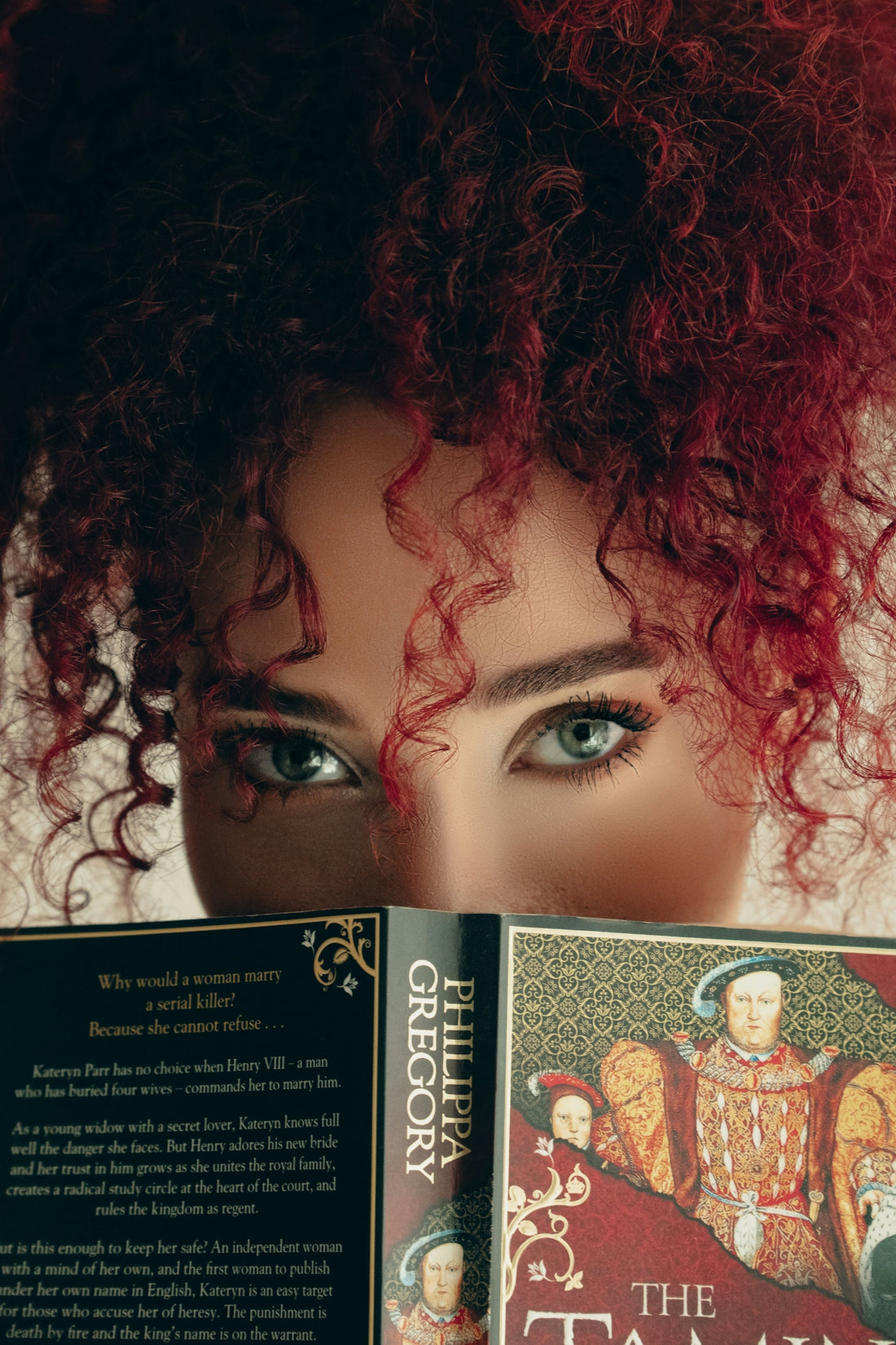 A close up of a person holding a book